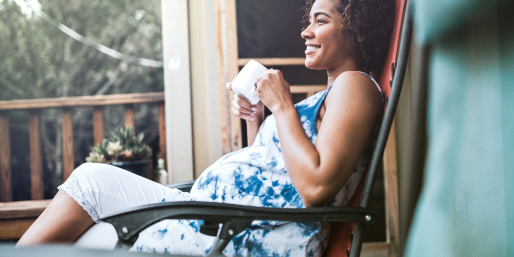 Pregnant woman matcha tea on porch